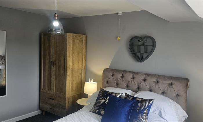 The Redford Cwtch Lounge – a cosy, welcoming space with soft seating, warm lighting, and rustic charm, perfect for relaxing with family or friends aft